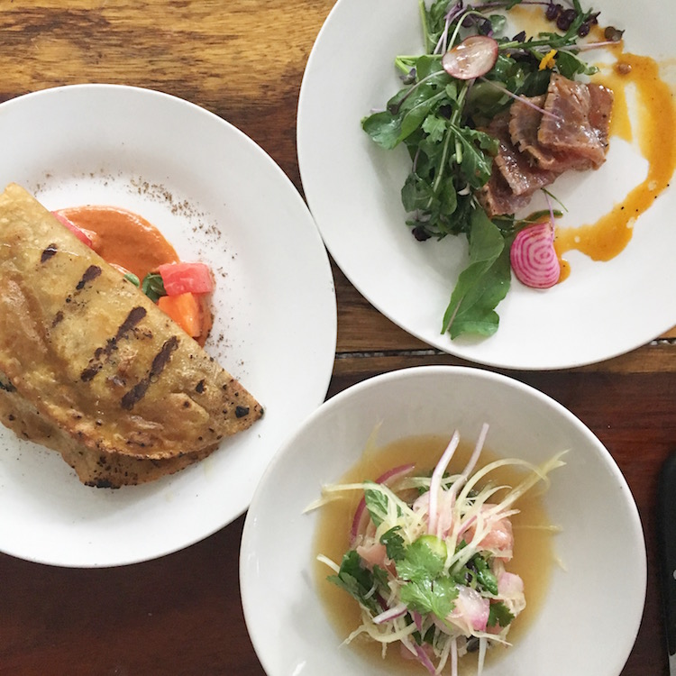 Image of papaya empanadas and ceviche at Hartwood in Tulum