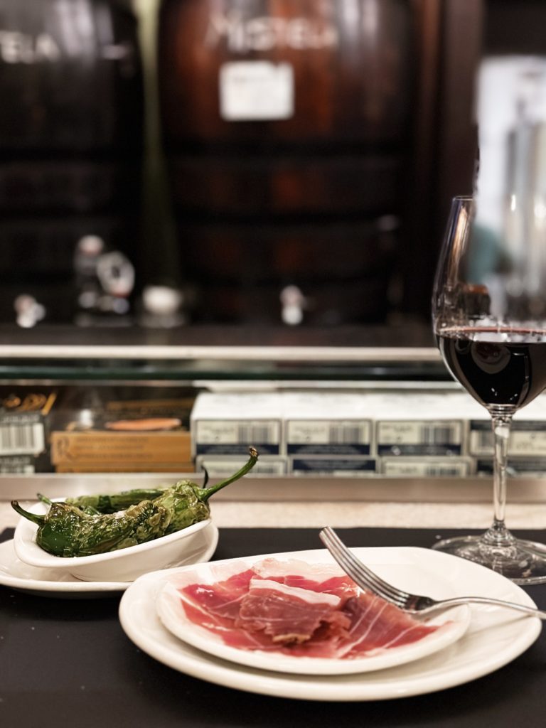 Picture of jamon ibérico and padrón peppers at Casa Montaña in Valencia, Spain.